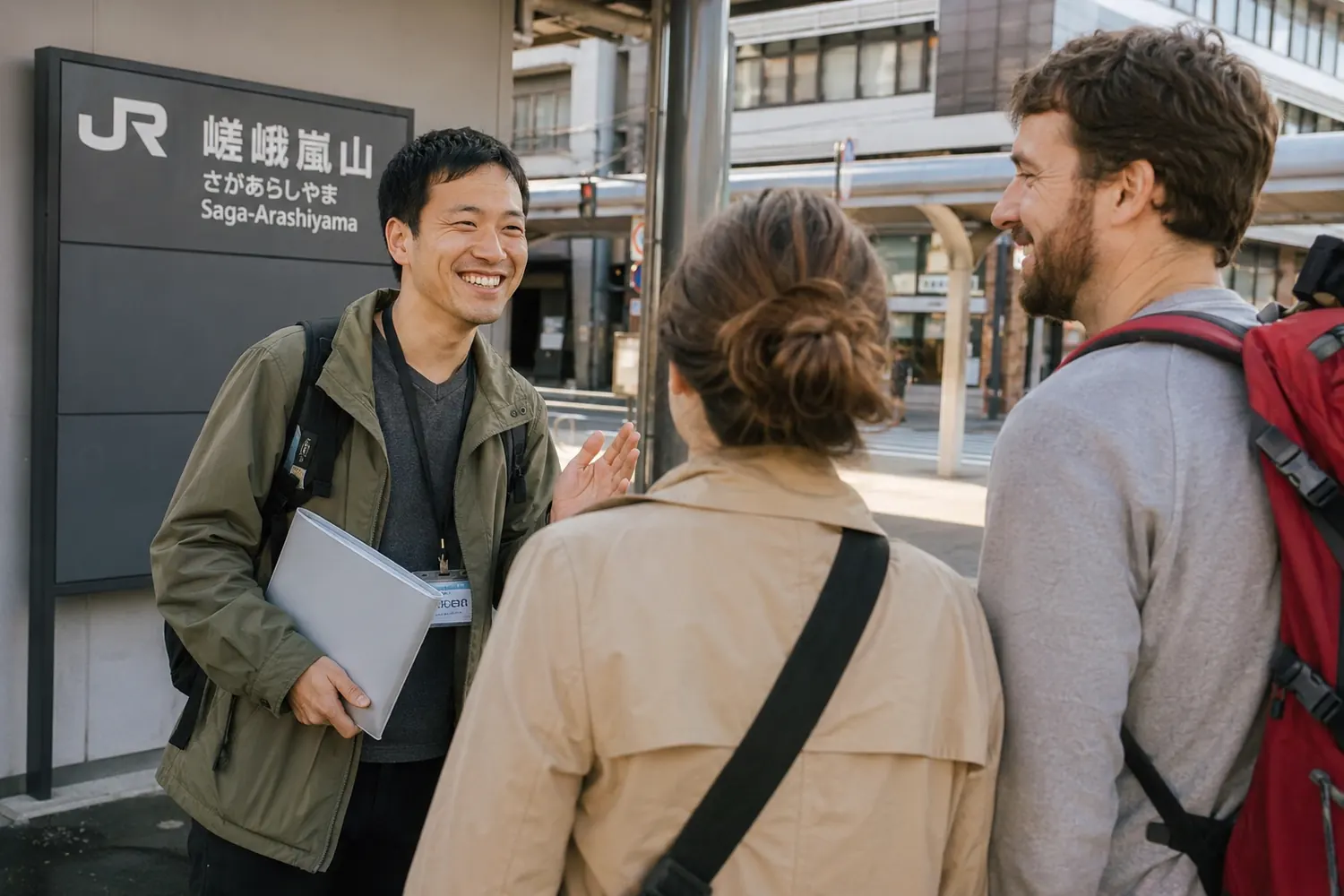 Travelers greeting a local host at a Japan train station