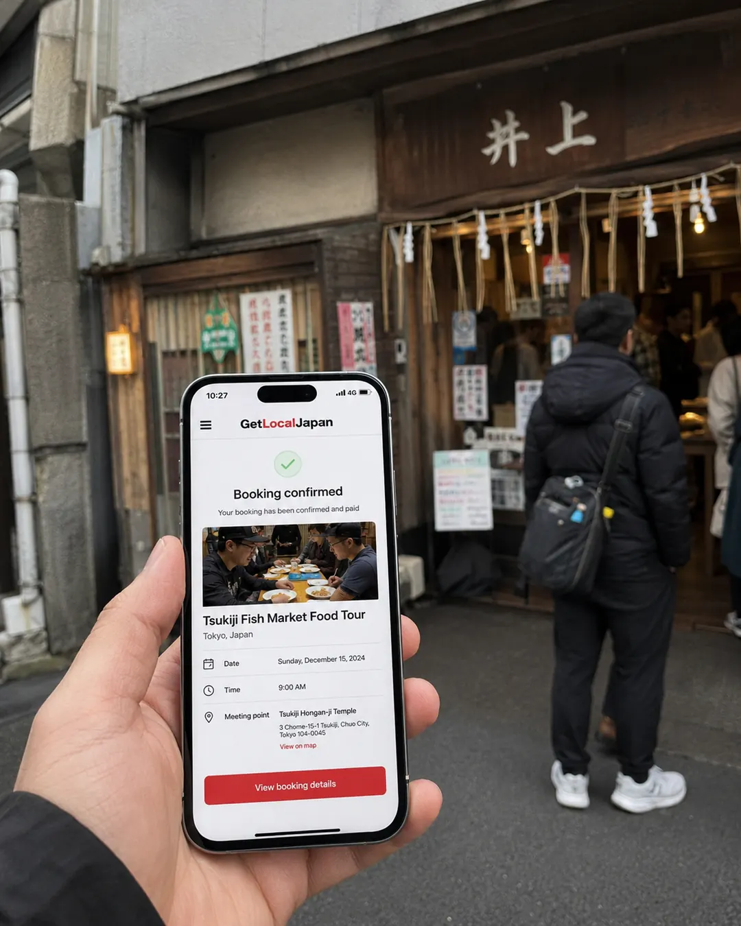 Phone showing a confirmed booking outside a local shop