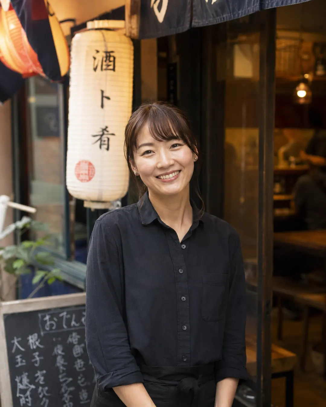 Food host portrait near an izakaya